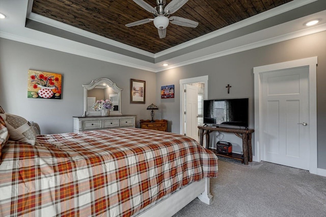 bedroom with a raised ceiling, wood ceiling, carpet flooring, and crown molding