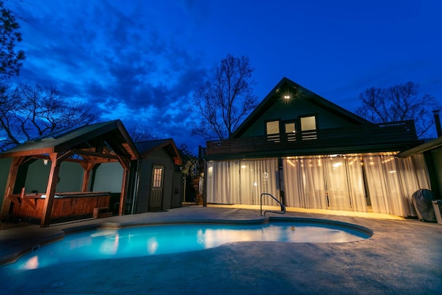 pool featuring a gazebo, a jacuzzi, a grill, and a patio