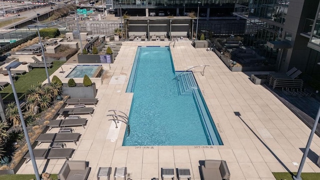 community pool featuring a patio area