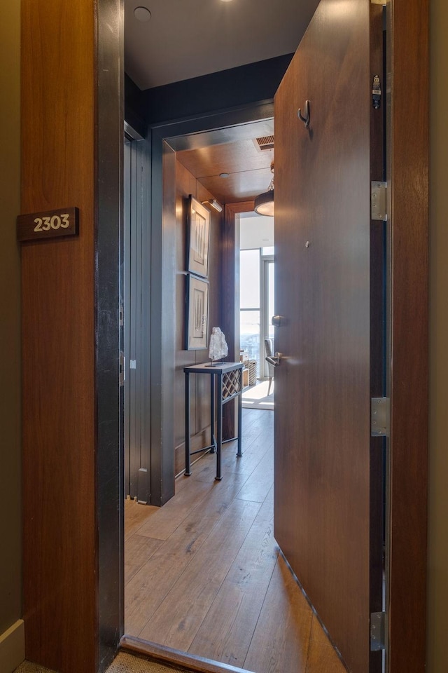 hallway featuring hardwood / wood-style flooring