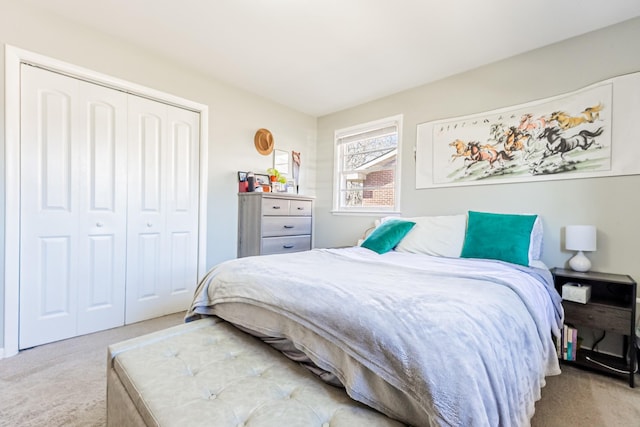 bedroom featuring a closet and carpet floors