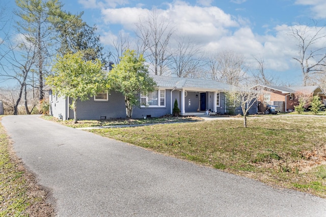 single story home featuring crawl space, brick siding, a front lawn, and aphalt driveway