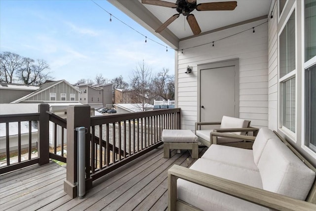 wooden deck with ceiling fan