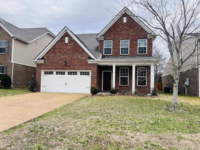 traditional-style house with driveway, covered porch, a front lawn, a garage, and brick siding