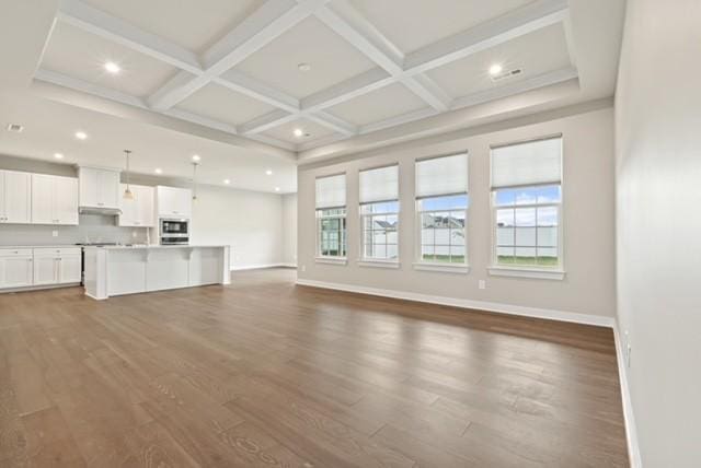 unfurnished living room with beamed ceiling, baseboards, coffered ceiling, and dark wood-style floors