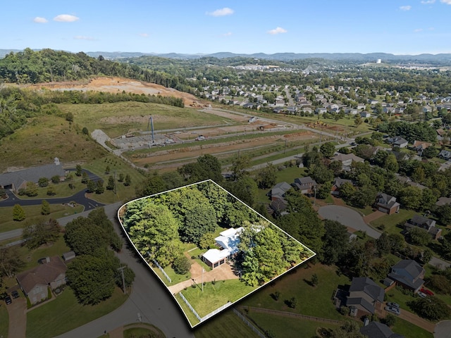 birds eye view of property with a residential view and a mountain view