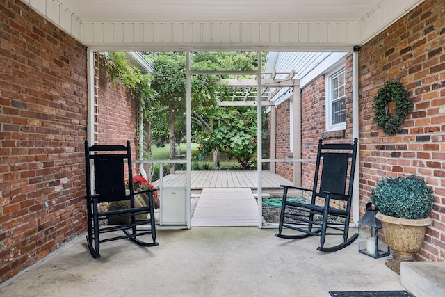 view of patio with a deck and a pergola