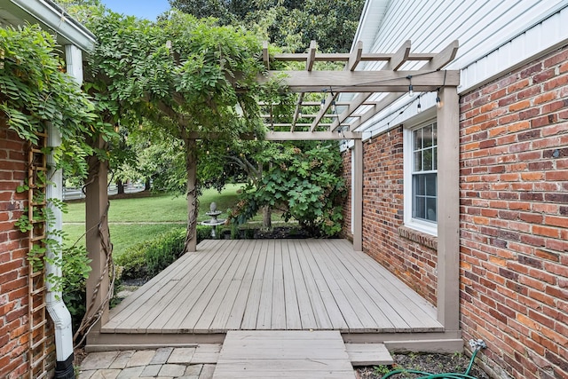 deck with a pergola and a yard