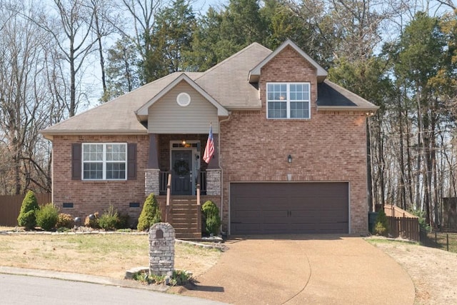 view of front of house with fence, an attached garage, concrete driveway, crawl space, and brick siding