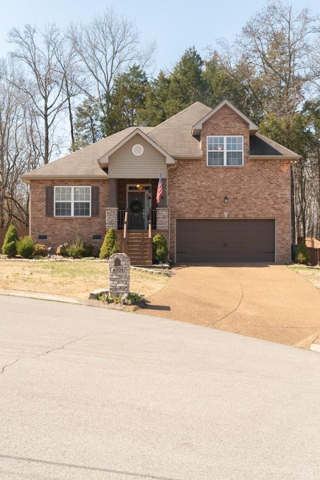 view of front facade with driveway, covered porch, an attached garage, crawl space, and brick siding