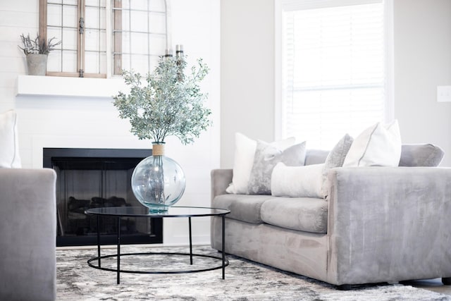 interior space featuring a glass covered fireplace