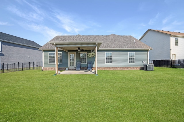 back of house featuring a ceiling fan, a yard, central AC unit, and a fenced backyard