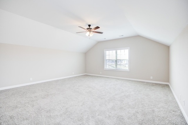 bonus room with carpet, visible vents, baseboards, lofted ceiling, and ceiling fan