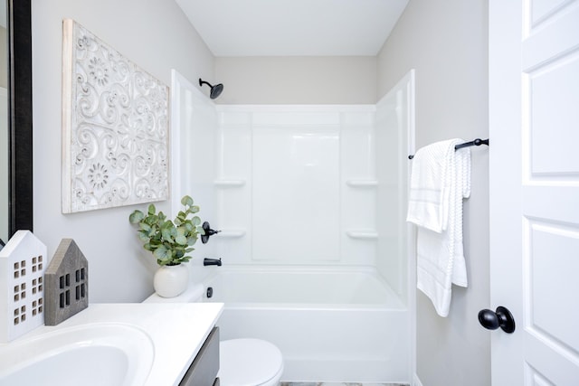 full bath with toilet, vanity, and washtub / shower combination