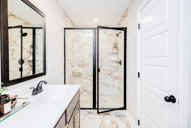 full bath with vanity, a stall shower, and marble finish floor