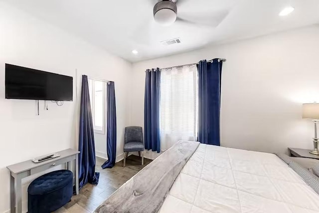 bedroom with recessed lighting, visible vents, multiple windows, and wood finished floors