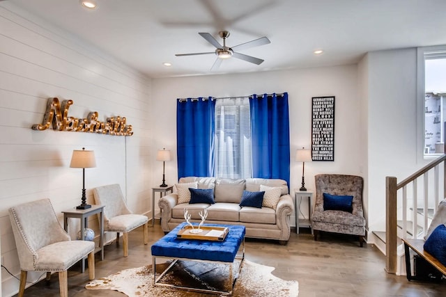 living area featuring recessed lighting, wood finished floors, stairs, and ceiling fan