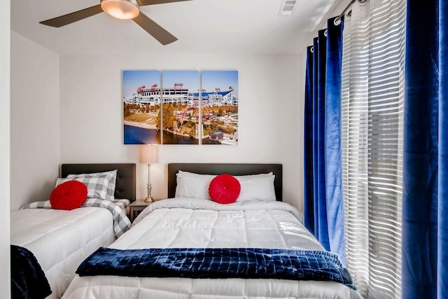 bedroom with visible vents and ceiling fan