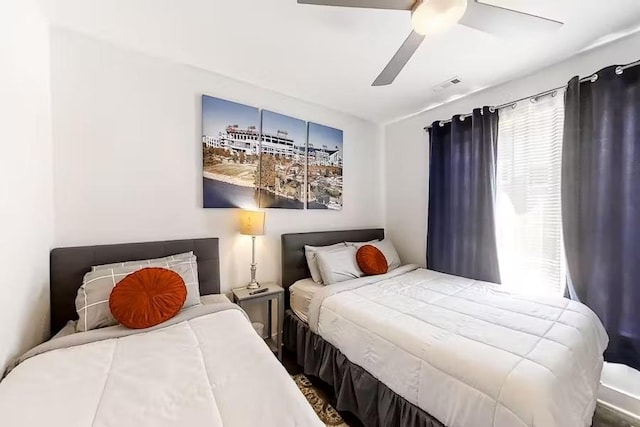 bedroom featuring visible vents and a ceiling fan