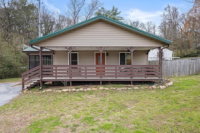 bungalow featuring a porch and a front yard