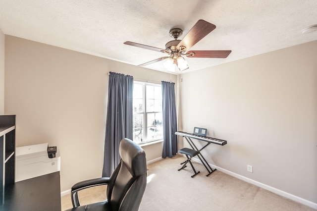 office featuring baseboards, light carpet, and a textured ceiling