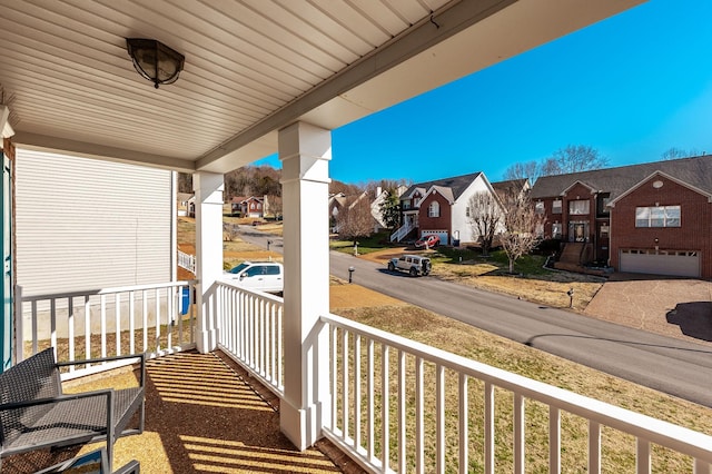 balcony featuring a residential view and a porch