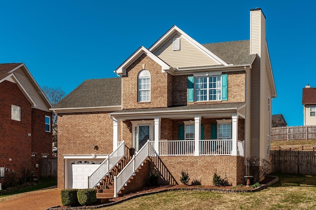 traditional home with a porch, fence, stairway, brick siding, and a chimney