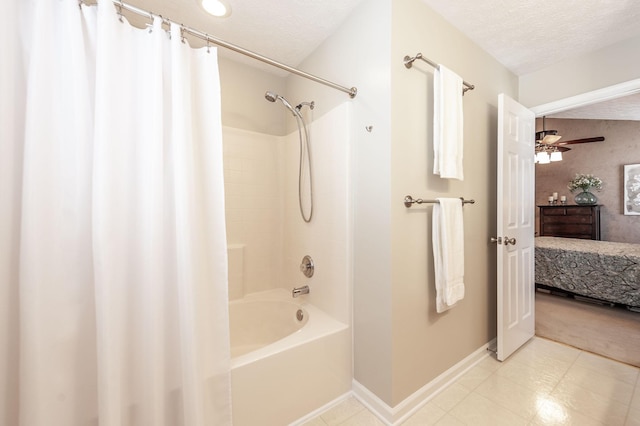 ensuite bathroom with shower / tub combo, connected bathroom, baseboards, and a textured ceiling