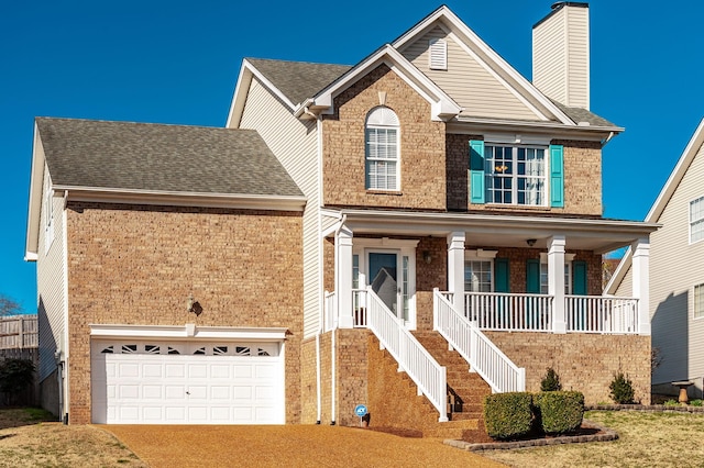 traditional-style home with brick siding, stairway, a porch, a chimney, and a garage