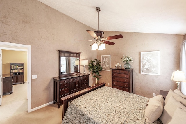 bedroom with light carpet, a ceiling fan, baseboards, and vaulted ceiling