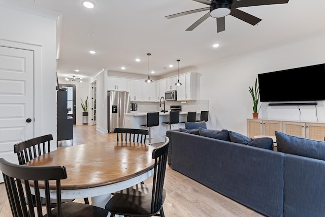 dining room featuring recessed lighting, light wood-style floors, and ceiling fan