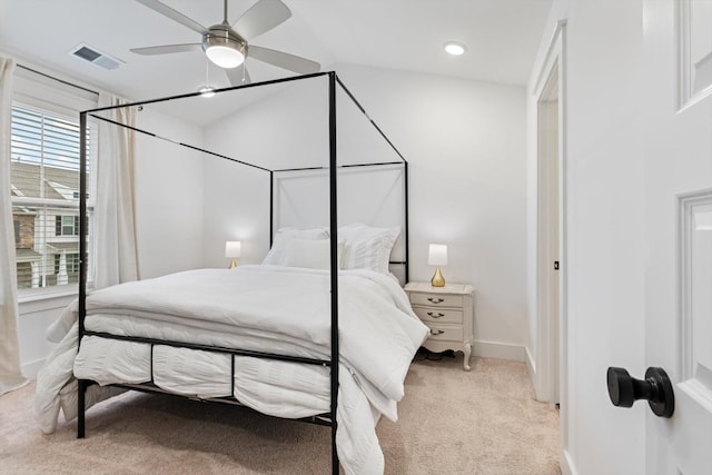 carpeted bedroom with visible vents, ceiling fan, and baseboards