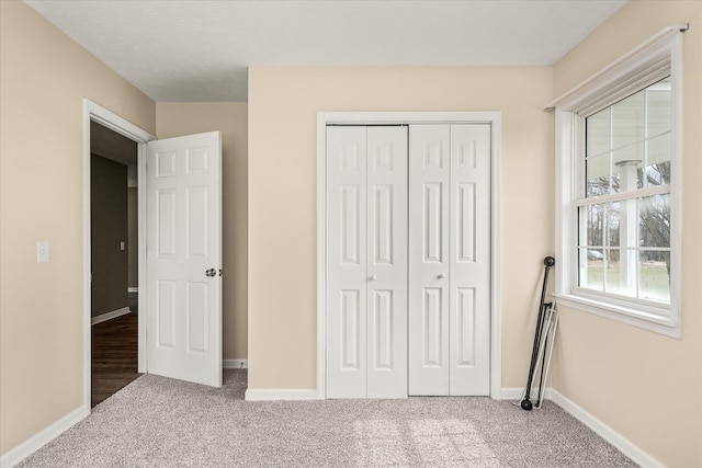 11216 Clay County Hwy, Moss, TN 38575 - unfurnished bedroom with a closet, baseboards, and carpet floors