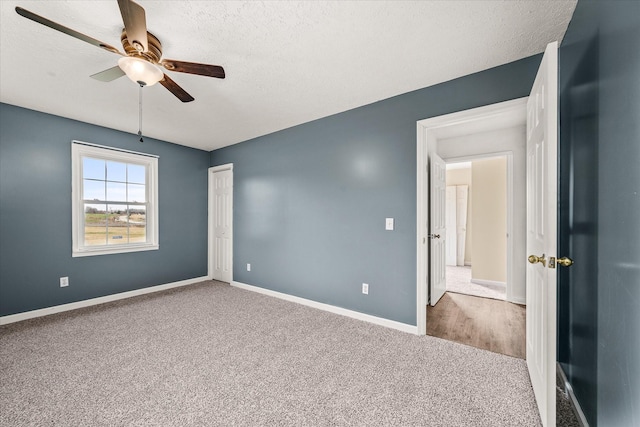 11216 Clay County Hwy, Moss, TN 38575 - spare room with baseboards, carpet, a ceiling fan, and a textured ceiling