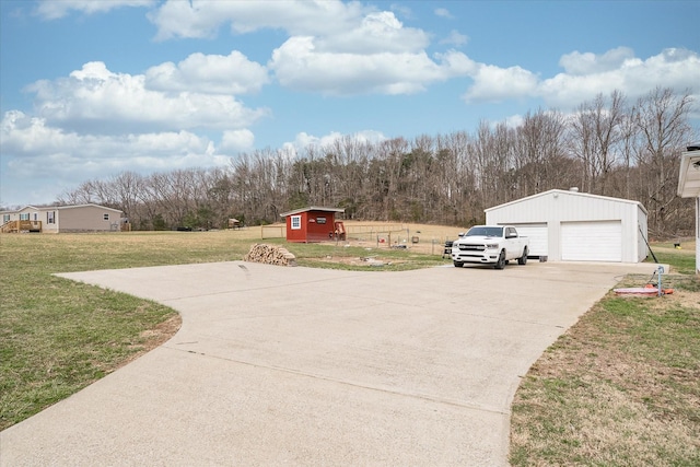 11216 Clay County Hwy, Moss, TN 38575 - view of yard with a garage, a forest view, and an outdoor structure