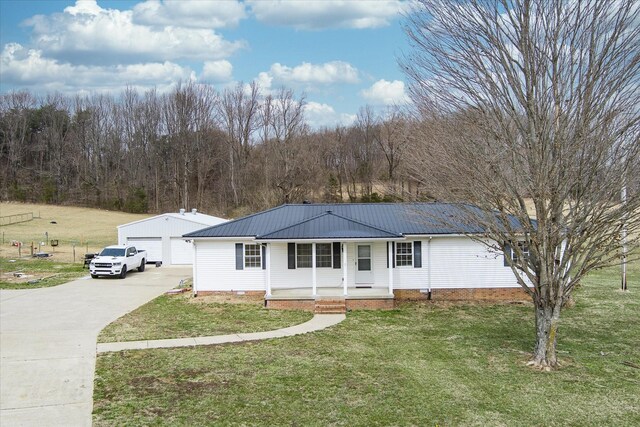 11216 Clay County Hwy, Moss, TN 38575 - ranch-style home featuring a garage, a front lawn, covered porch, an outdoor structure, and metal roof