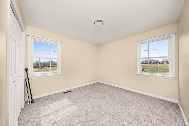 11216 Clay County Hwy, Moss, TN 38575 - spare room with baseboards, visible vents, and carpet floors