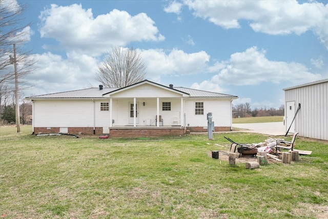 11216 Clay County Hwy, Moss, TN 38575 - back of property with crawl space, a porch, metal roof, and a yard