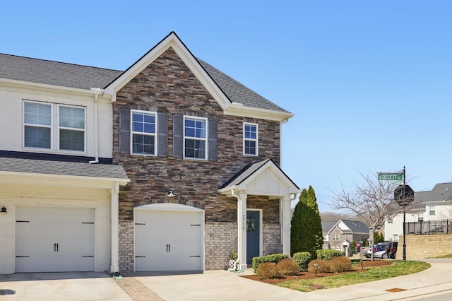 view of front of property with brick siding, driveway, an attached garage, and a shingled roof