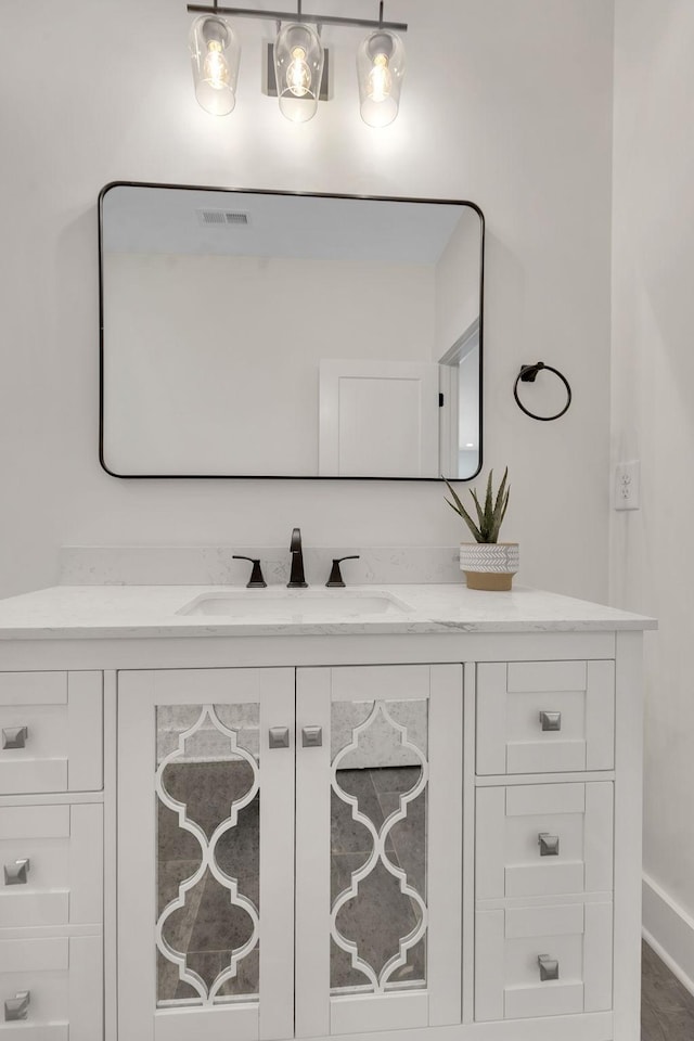 bathroom with vanity and visible vents