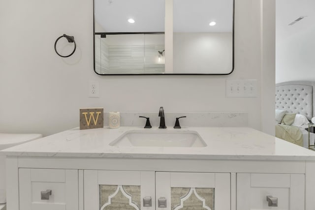 full bathroom with visible vents, recessed lighting, and vanity