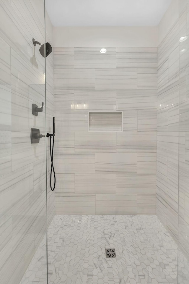 bathroom with a tile shower