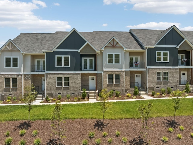 view of front of property featuring brick siding, board and batten siding, a shingled roof, cooling unit, and crawl space