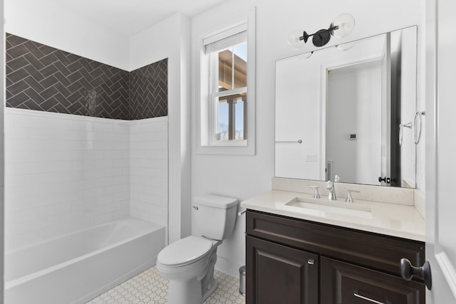 bathroom featuring toilet, vanity, and bathing tub / shower combination