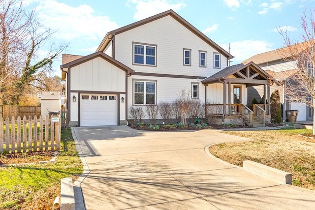 view of front of home featuring fence, covered porch, board and batten siding, concrete driveway, and a garage