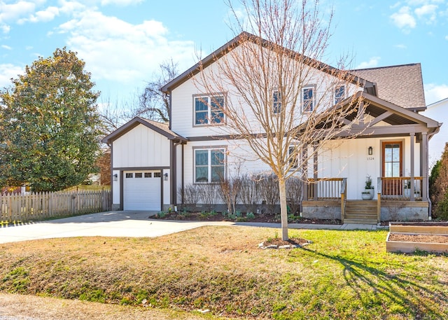 view of front of house with fence, a porch, a front yard, a garage, and driveway