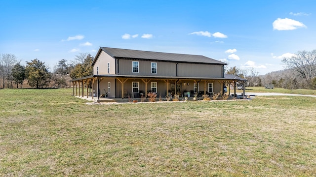 view of front of home featuring a front yard, a porch, and metal roof