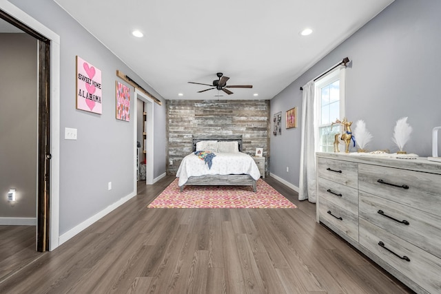 unfurnished bedroom featuring a ceiling fan, recessed lighting, wood finished floors, and baseboards