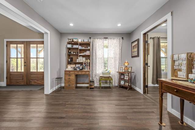 living area featuring dark wood finished floors, recessed lighting, french doors, and baseboards