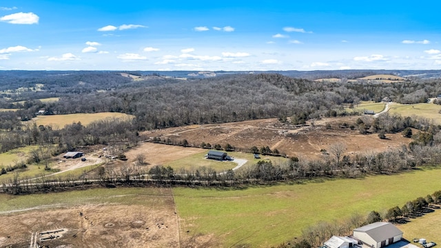 drone / aerial view with a rural view and a wooded view